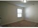 Bright bedroom with neutral walls, carpet, and a window at 897 Golden Plum Ln, Zebulon, NC 27597