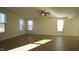Spacious living room with hardwood floors and lots of natural light at 897 Golden Plum Ln, Zebulon, NC 27597