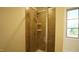 Large walk in shower with tiled walls and a glass door at 897 Golden Plum Ln, Zebulon, NC 27597
