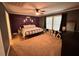A calming bedroom featuring plush carpeting, modern decor, and soft lighting creating a peaceful retreat at 979 Natchez Trce, Fuquay Varina, NC 27526