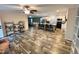 Expansive living room boasts wood floors, an island with seating, and a cozy lounge space at 979 Natchez Trce, Fuquay Varina, NC 27526