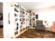 Cozy sitting room with floor to ceiling bookshelves, an accent chair, and wood-look vinyl flooring at 979 Natchez Trce, Fuquay Varina, NC 27526