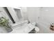 Well-lit bathroom featuring a modern vanity, toilet, and bathtub with shower at 147 Charlotte Knoll St # 14, Zebulon, NC 27597