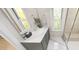 Bathroom features a modern vanity with a sleek countertop, a framed mirror, and a shower at 147 Charlotte Knoll St # 14, Zebulon, NC 27597