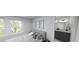 Cozy bedroom with natural light, featuring neutral walls, artwork, and access to an en-suite bathroom at 147 Charlotte Knoll St # 14, Zebulon, NC 27597
