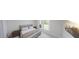 Comfortable bedroom with a plush bed, wooden side tables, and bright windows overlooking the outdoors at 147 Charlotte Knoll St # 14, Zebulon, NC 27597