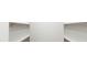 Functional walk-in closet with rod for hanging clothes and upper shelving at 147 Charlotte Knoll St # 14, Zebulon, NC 27597