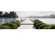 Picturesque view of the community dock with serene water and manicured bushes at 147 Charlotte Knoll St # 14, Zebulon, NC 27597