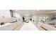 Modern kitchen featuring an island with seating, stainless steel appliances, and an open layout at 147 Charlotte Knoll St # 14, Zebulon, NC 27597
