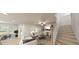 Inviting living room with fireplace, plush seating, and ample natural light, adjacent to the staircase at 147 Charlotte Knoll St # 14, Zebulon, NC 27597