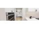 Walk-in pantry with organized shelving, alongside modern oven and microwave combo at 147 Charlotte Knoll St # 14, Zebulon, NC 27597