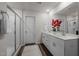 Elegant bathroom with double vanity and large mirror at 1007 Cherry Stem Rd, Haw River, NC 27258