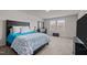 Main bedroom with a comfortable bed and plenty of light at 1007 Cherry Stem Rd, Haw River, NC 27258