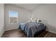 Cozy bedroom with neutral decor and a large window at 1007 Cherry Stem Rd, Haw River, NC 27258