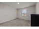 Spacious bedroom with large window and carpeted floor at 1007 Cherry Stem Rd, Haw River, NC 27258