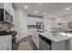 Modern kitchen with white cabinets, quartz countertops, and stainless steel appliances at 1007 Cherry Stem Rd, Haw River, NC 27258
