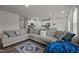 Spacious living room with large sectional sofa and access to kitchen at 1007 Cherry Stem Rd, Haw River, NC 27258