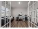 Bright office space featuring hardwood floors and French doors at 1007 Cherry Stem Rd, Haw River, NC 27258