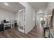 Home office with hardwood floors, built-in shelving, and French doors at 1007 Cherry Stem Rd, Haw River, NC 27258