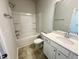 Bathroom featuring tile floors, a single sink vanity, a shower/tub combo, and modern fixtures at 103 Central Townes Way # 297, Raleigh, NC 27603