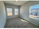 Bedroom with carpet, natural light from windows, and views of the surrounding neighborhood at 103 Central Townes Way # 297, Raleigh, NC 27603