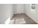 Inviting entryway featuring a light-colored floor, a large window and a white front door at 103 Central Townes Way # 297, Raleigh, NC 27603
