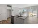 Open kitchen featuring an island with a sink and stainless steel dishwasher at 103 Central Townes Way # 297, Raleigh, NC 27603
