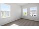 Bedroom with carpeted floors, neutral walls, and multiple windows for natural light at 104 Central Townes Way # 296, Raleigh, NC 27603