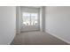 Bedroom with carpeted floors, neutral walls, and a single window at 104 Central Townes Way # 296, Raleigh, NC 27603