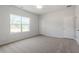 Large bedroom with carpet, bright window, and two closets at 104 Central Townes Way # 296, Raleigh, NC 27603