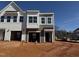 New construction townhome featuring a modern design, an attached garage and natural light at 104 Central Townes Way # 296, Raleigh, NC 27603