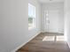 Bright entryway with beautiful wood-look floors and a large window at 104 Central Townes Way # 296, Raleigh, NC 27603