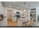 Modern kitchen with stainless steel appliances, granite countertops, and a convenient center island with bar stool seating at 104 Central Townes Way # 296, Raleigh, NC 27603