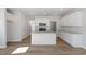 Bright, modern kitchen with white cabinets, granite counters and stainless steel appliances at 104 Central Townes Way # 296, Raleigh, NC 27603