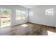 Bright living area with wood-look floors, sliding glass door and backyard views at 104 Central Townes Way # 296, Raleigh, NC 27603