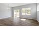 Bright living area with wood-look floors, sliding glass door and backyard views at 104 Central Townes Way # 296, Raleigh, NC 27603