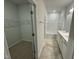 Bathroom features a tub/shower combo, tile floors and double sink at 107 Central Townes Way # 298, Raleigh, NC 27603