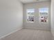 Bedroom windows overlooking the neighborhood at 107 Central Townes Way # 298, Raleigh, NC 27603
