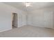 A bedroom with two closets, and a view to the ensuite bathroom at 107 Central Townes Way # 298, Raleigh, NC 27603
