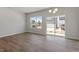 Dining room features wood floors and bright windows with backyard views at 107 Central Townes Way # 298, Raleigh, NC 27603