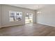 Dining room features wood floors and bright windows with backyard views at 107 Central Townes Way # 298, Raleigh, NC 27603