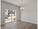 Dining room features wood floors and sliding glass doors to backyard at 107 Central Townes Way # 298, Raleigh, NC 27603