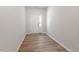 Entry way with wood floors and white door at 107 Central Townes Way # 298, Raleigh, NC 27603
