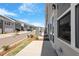 Charming townhomes with attached garages and beautifully landscaped sidewalks under a bright sky at 107 Central Townes Way # 298, Raleigh, NC 27603