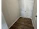 Spacious hallway with luxury vinyl flooring and access to utility areas at 107 Central Townes Way # 298, Raleigh, NC 27603
