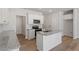 Bright kitchen features stainless appliances, granite counters and a kitchen island at 107 Central Townes Way # 298, Raleigh, NC 27603