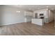 Open floor plan with white cabinets and kitchen island at 107 Central Townes Way # 298, Raleigh, NC 27603