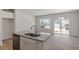 New kitchen with stainless dishwasher, granite counters and white cabinets at 107 Central Townes Way # 298, Raleigh, NC 27603