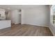 Bright living room with wood-look flooring and a large window at 107 Central Townes Way # 298, Raleigh, NC 27603
