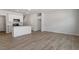 Open-concept living room flows into kitchen featuring stainless steel appliances at 107 Central Townes Way # 298, Raleigh, NC 27603